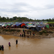 Refugees cross a stream to reach their temporary shelters at the Bangladesh-Myanmar border.